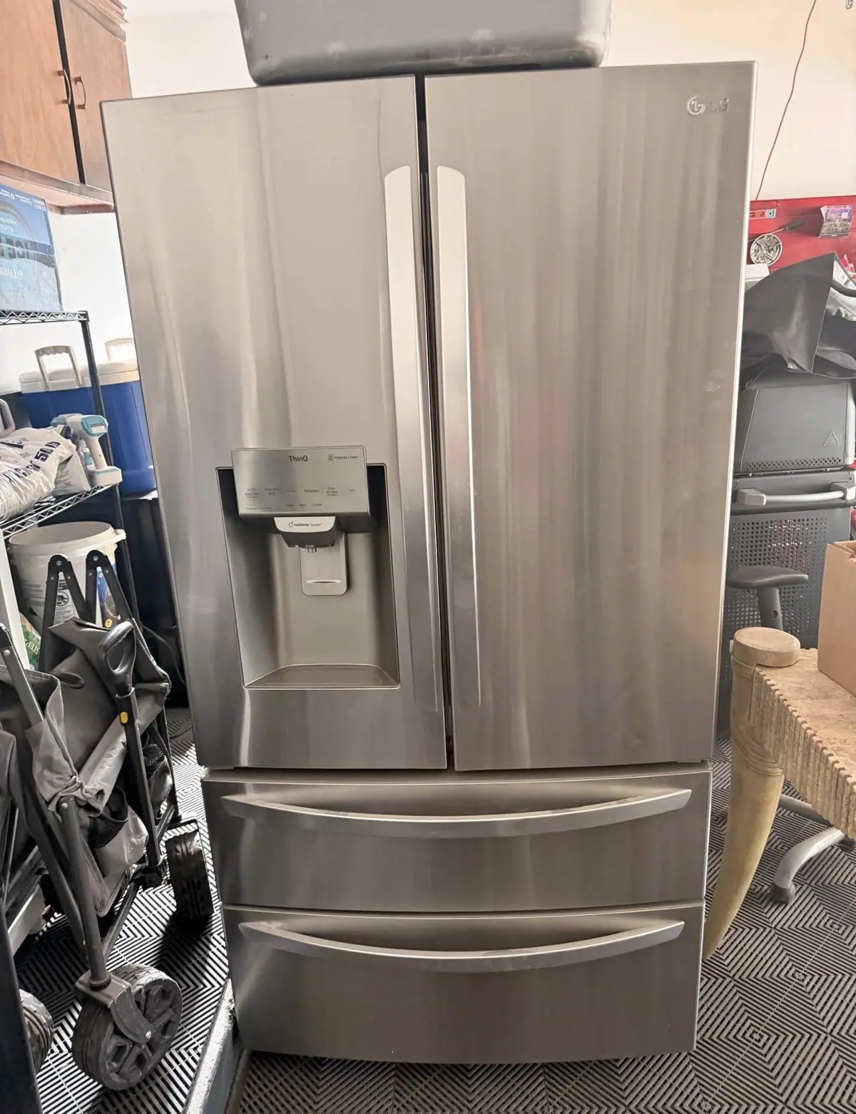 Stainless French door refrigerator with a water dispenser