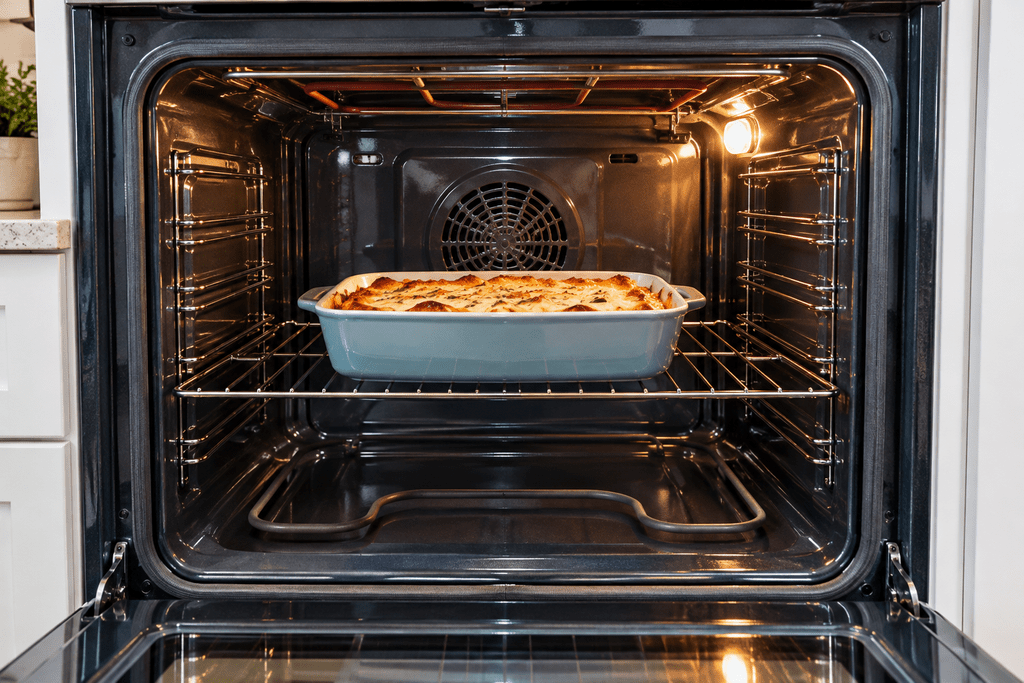 Baking dish centered on an oven rack with open space for heat circulation